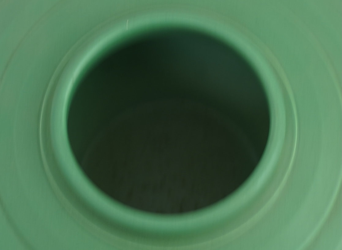 Keith Murray MC RDI FRIBA (New Zealand/British, 1892-1981) for Wedgwood: A matt green glazed angular vase